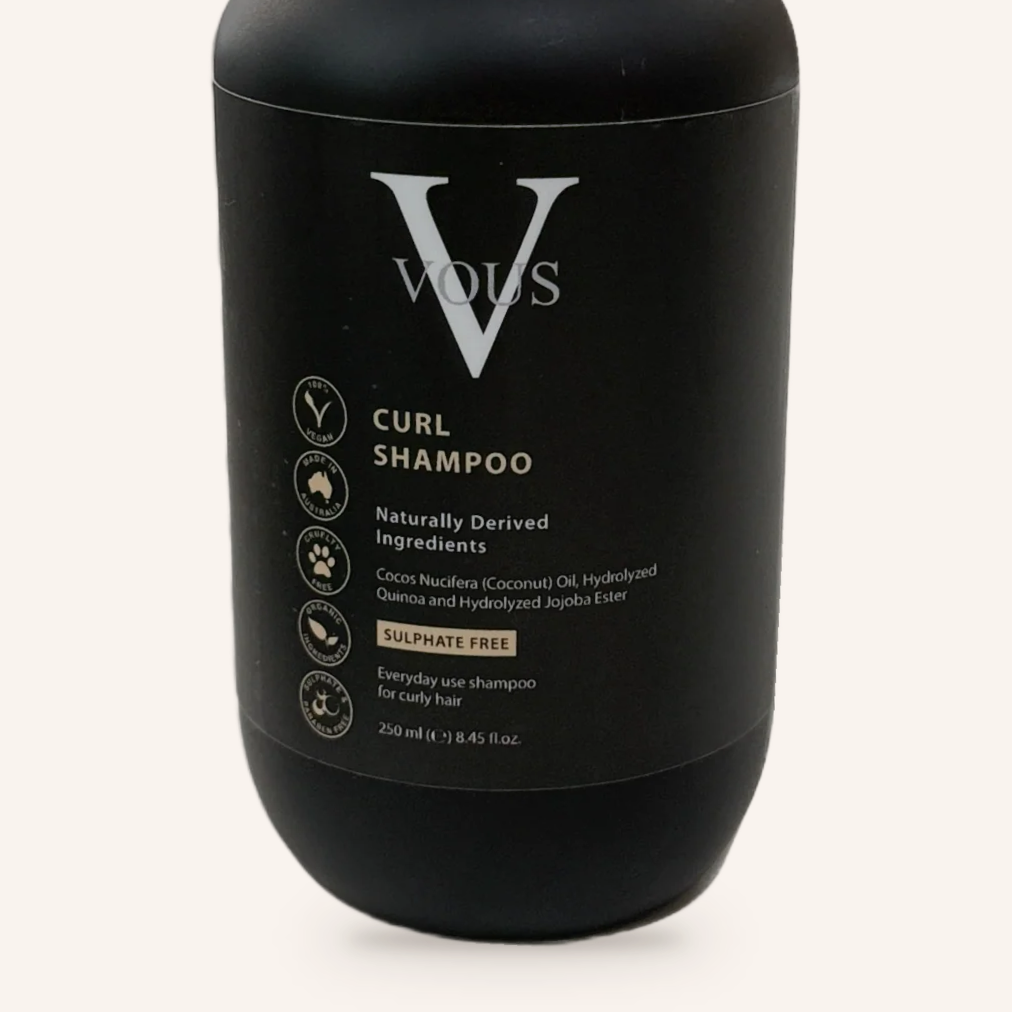 Close-up of the Vous Care Curl Shampoo label