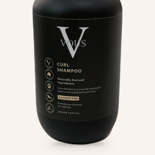 Close-up of the Vous Care Curl Shampoo label